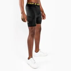 Venum G-Fit Compression Shorts, Black/Gold 12 Venum G-Fit Compression Shorts, Black/Gold -Udstyr og tilbehør butik VENUM 03725 126R Venum G Fit Compression Shorts Black Gold 03 0522