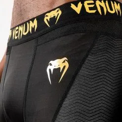 Venum G-Fit Compression Shorts, Black/Gold 16 Venum G-Fit Compression Shorts, Black/Gold -Udstyr og tilbehør butik VENUM 03725 126R Venum G Fit Compression Shorts Black Gold 07 0522