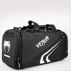 Venum Trainer Lite Evo Sports Bag, Black/Black -Udstyr og tilbehør butik VENUM 03830 108 Venum Trainer Lite Evo Sports Bag BlackWhite 01 maj2